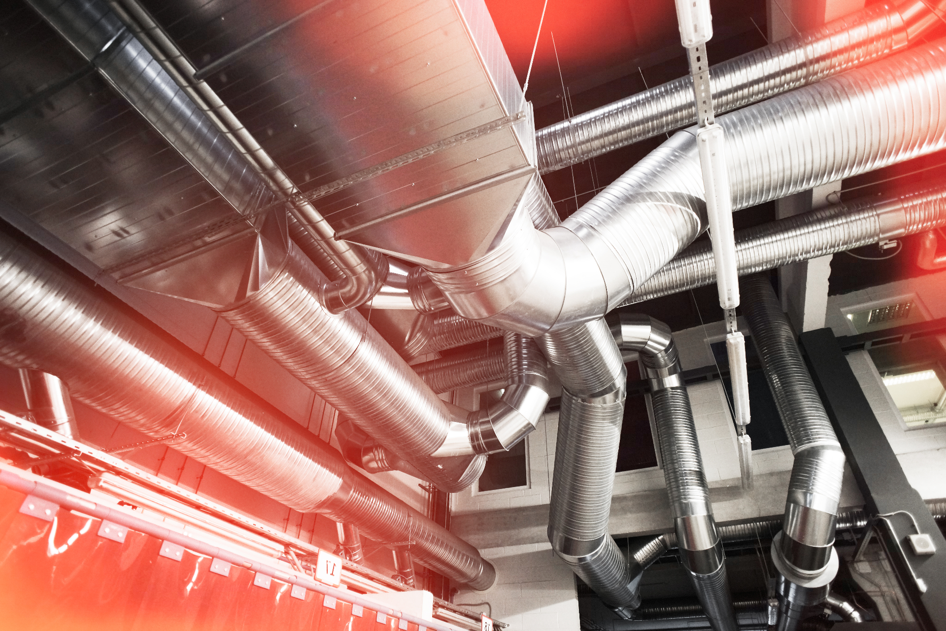 HVAC technician servicing outdoor air conditioning units